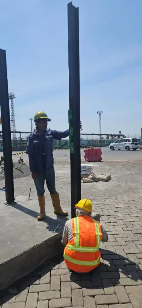 Tukang bangunan dan tukas las